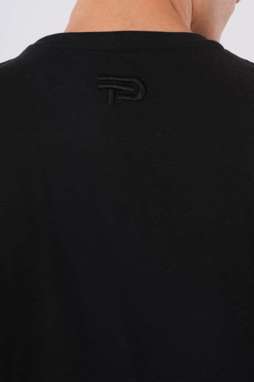 Black oversized tshirt made with 220 GSM combed cotton — lifestyle